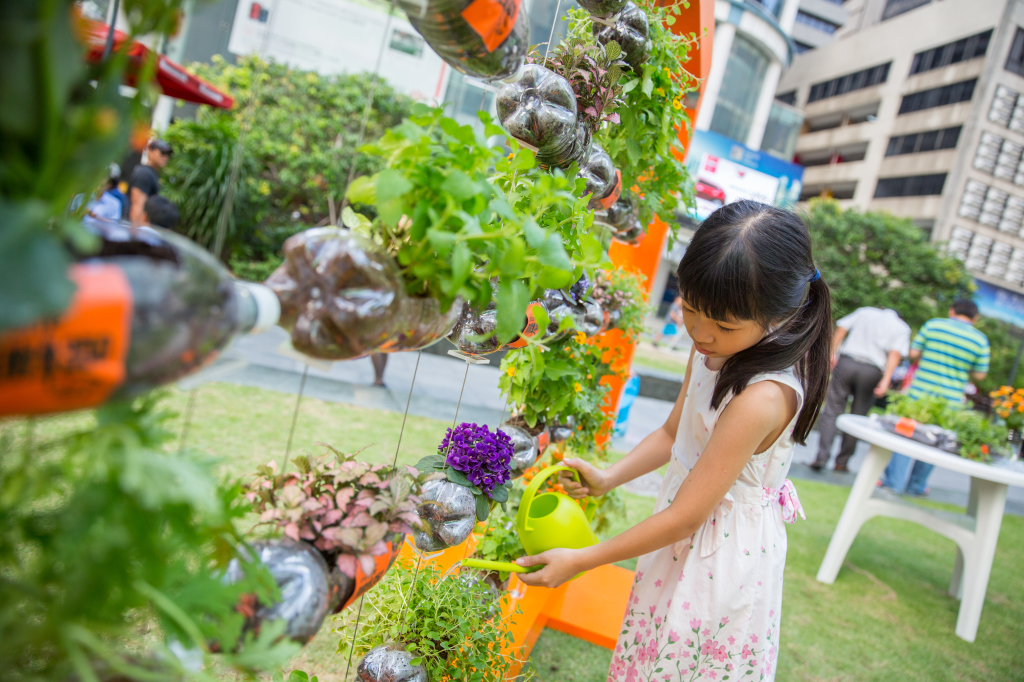'Watering' the plants on display.
