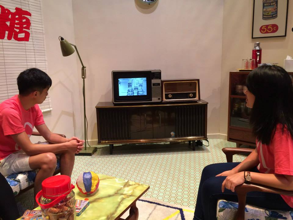 Zhi Wen (right) catches the very first NDP - in 1996 - on TV.