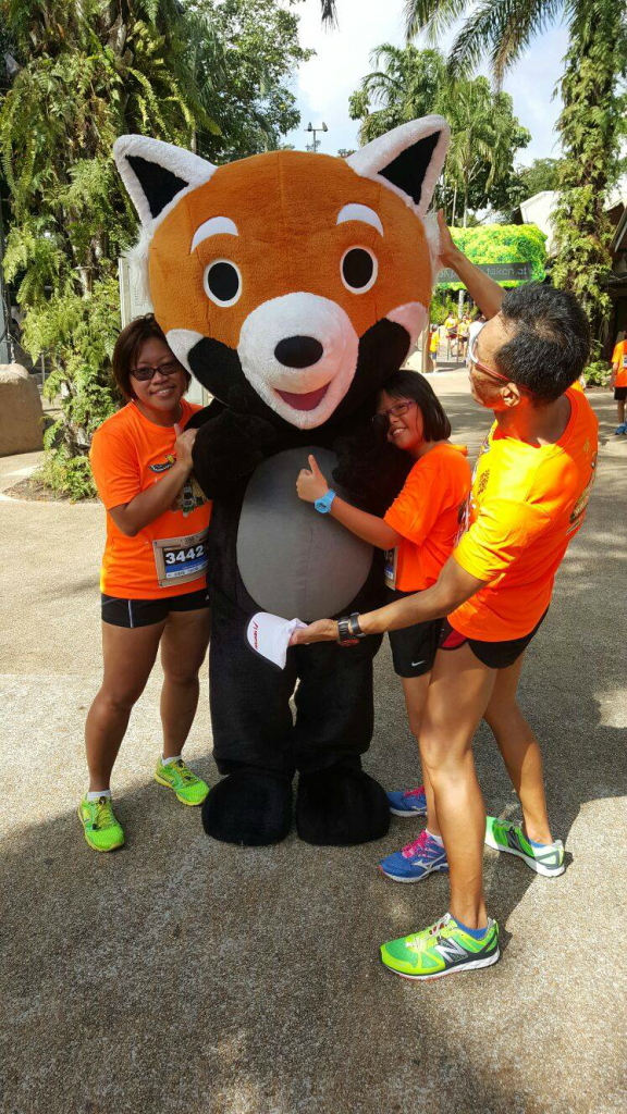 Desmond Loh and his family with the animal mascots. [Photo credit to Desmond]