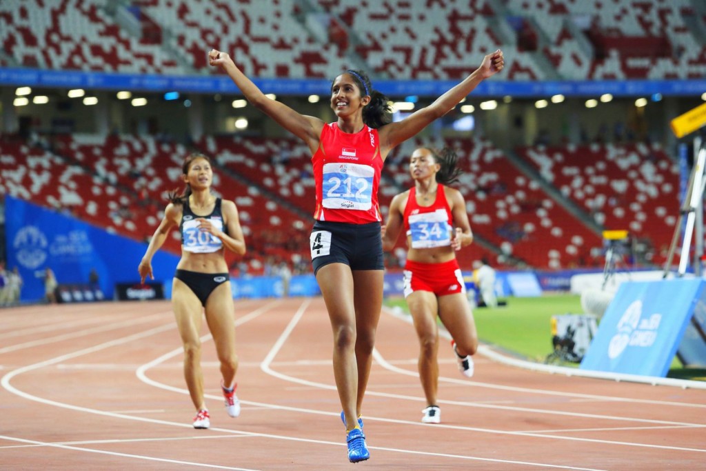 Shanti raises her arms in triumph. Photo by: www.todayonline.com