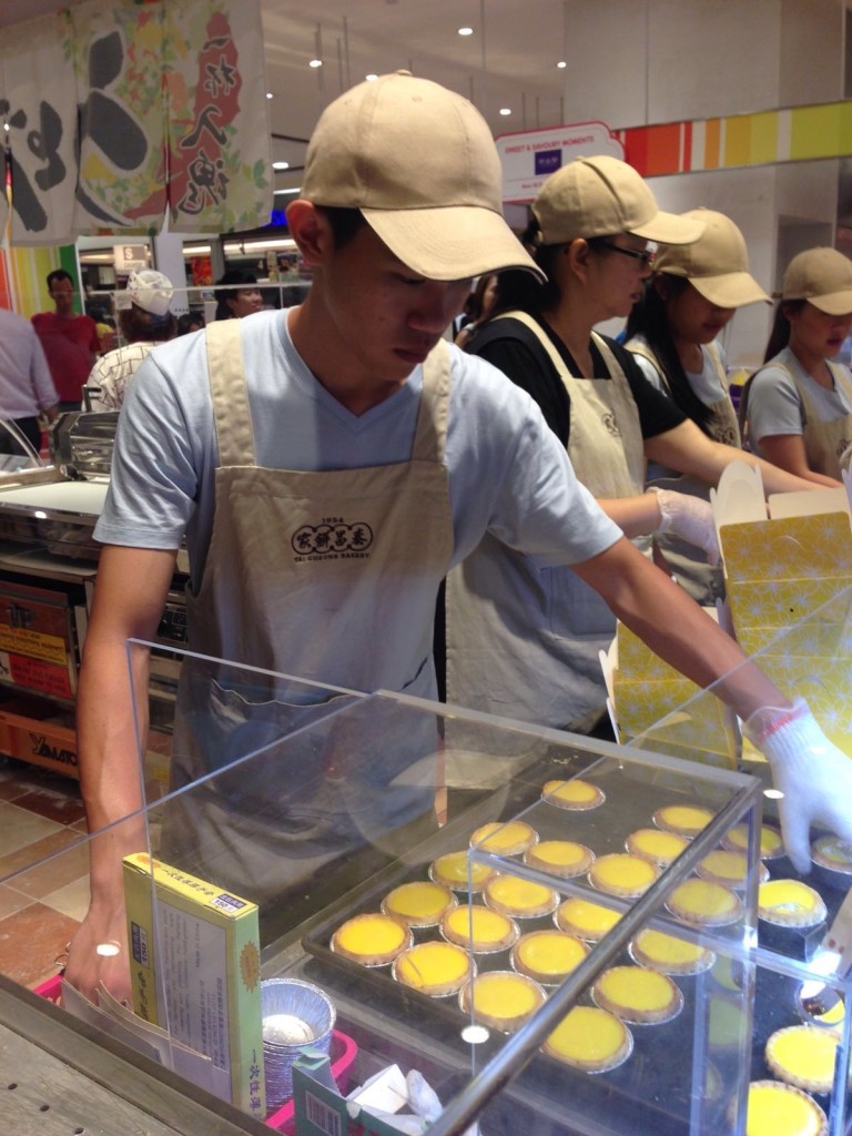 Producing egg tarts for hungry Singaporeans is hard work.