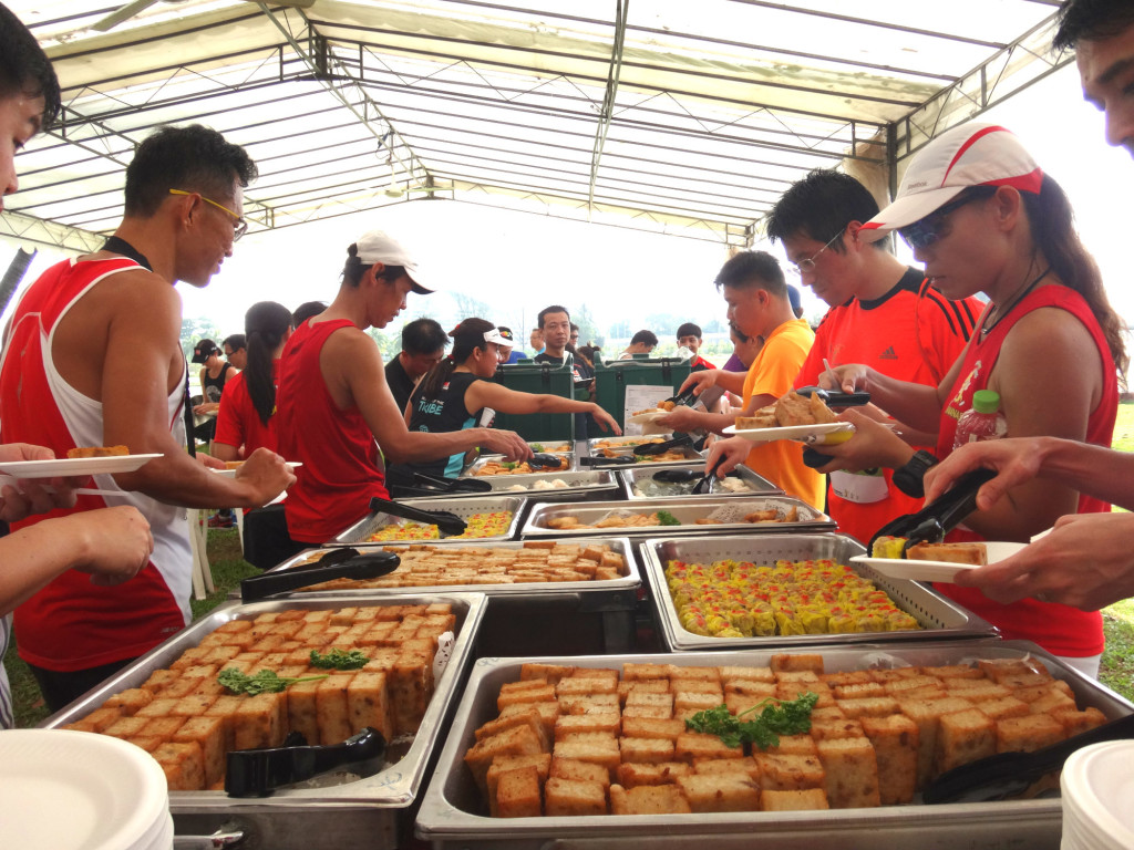 Runners tuck into some food.