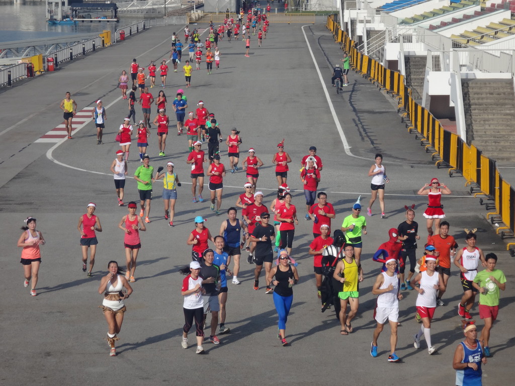 Runners cross The Float @ Marina Bay.