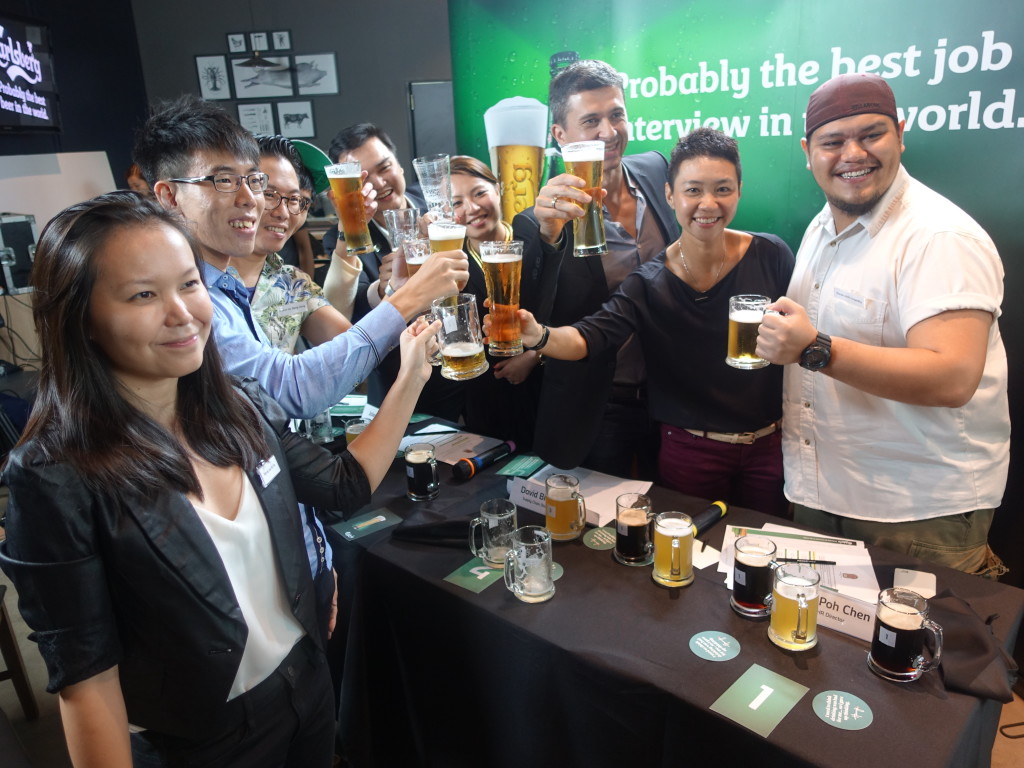 Contestants and judges say 'cheers' over a beer.