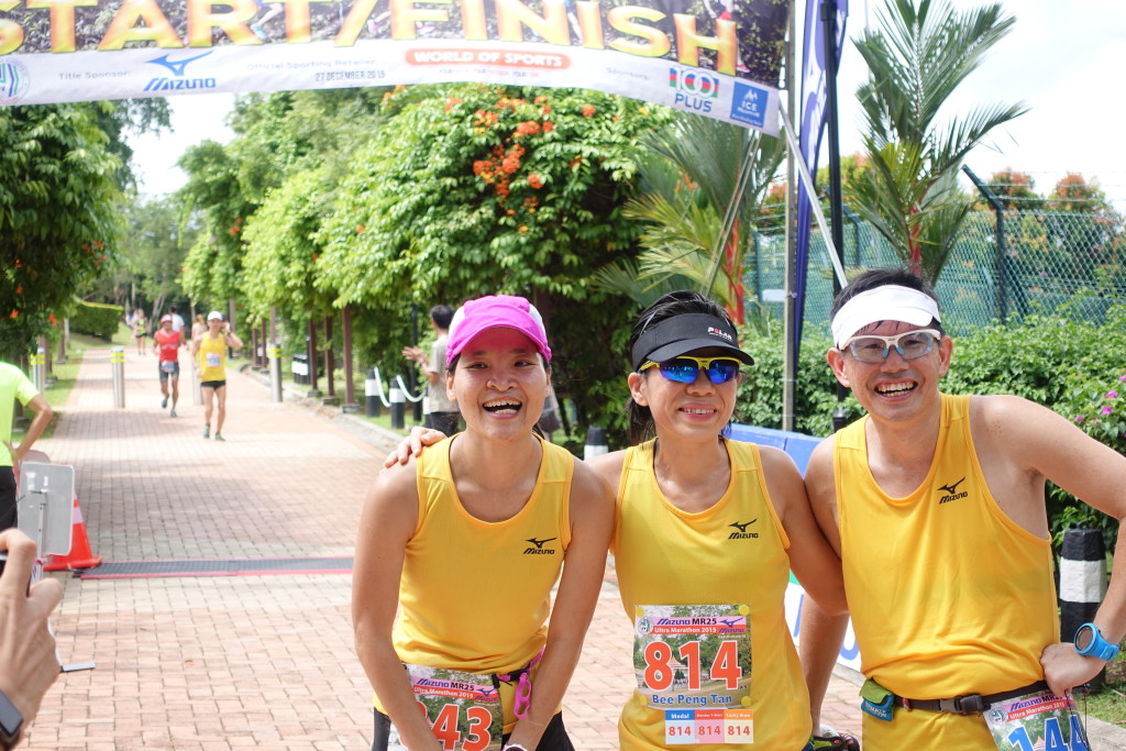 Tired runners pose for a photo in between loops.
