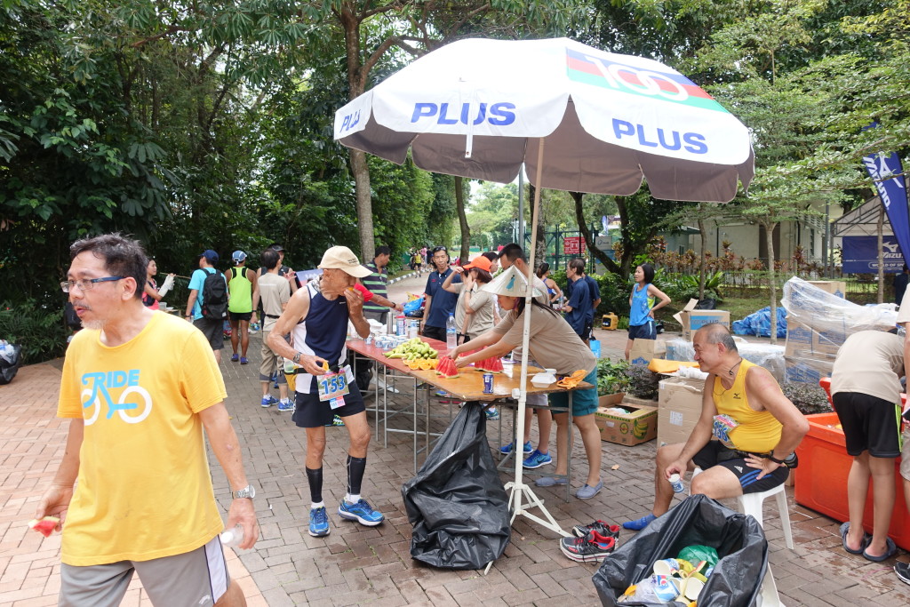 Runners making full use of the aid station.