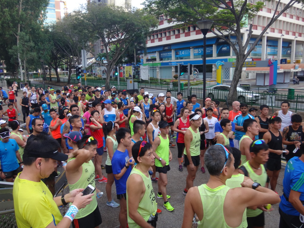 Runners and pacers congregate outside Parkway Parade.
