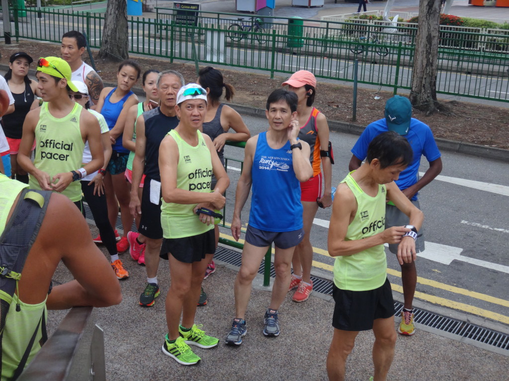 Runners set their GPS watches before taking off.