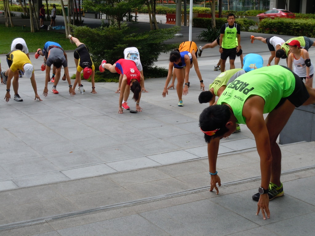 An Earth Runners pacer leads the participants through warm-up exercises.