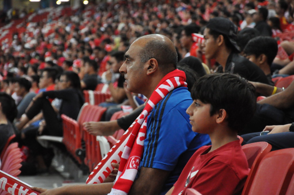 A father and his young son at the game.