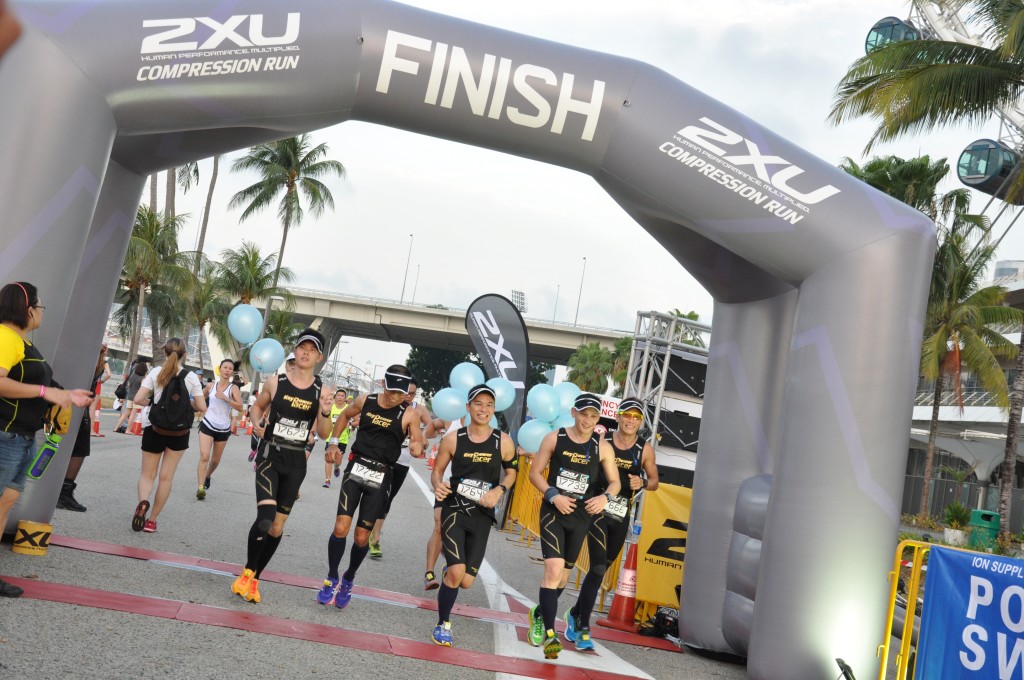 A group of pacers cross the finishing line.