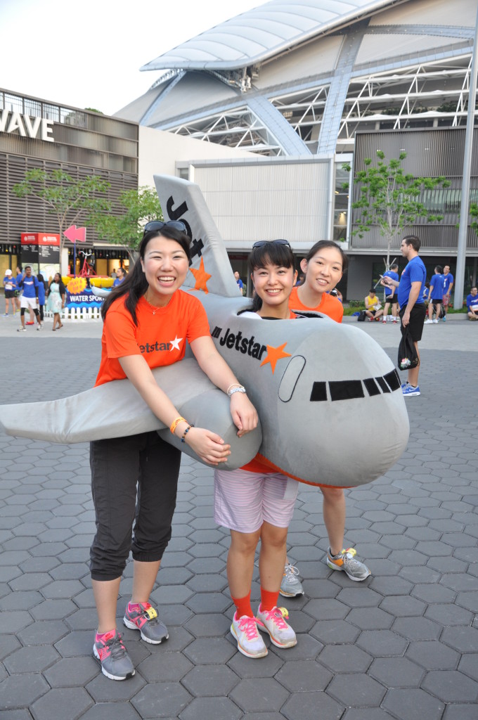 A girl poses with an airplane costume.
