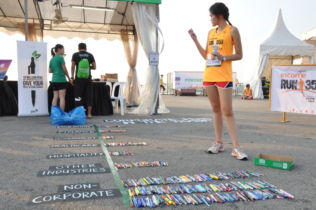 Runners sorted out some pens, in another green activity at the race village.