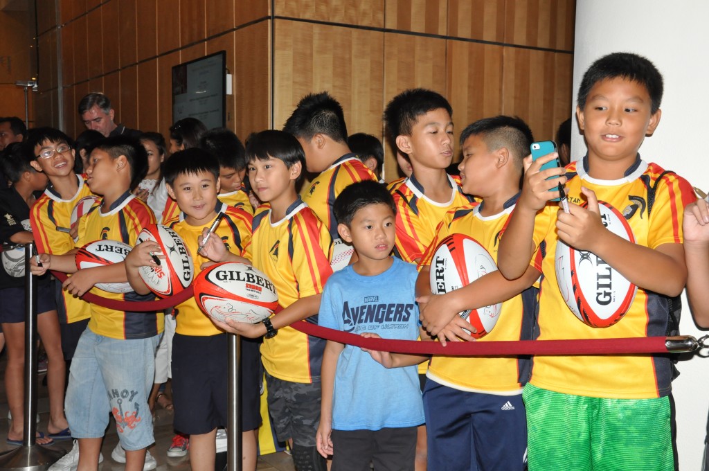 Eager young rugby fans look forward to seeing their idols.