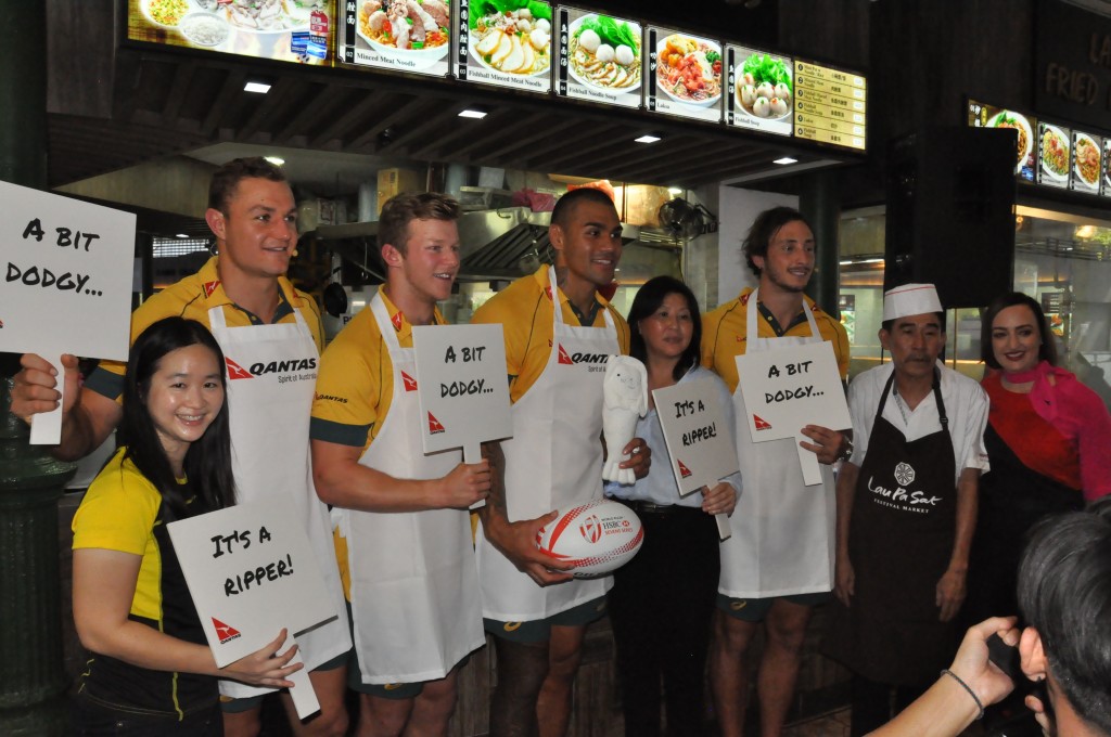 Judges and players gamely pose with the signs.