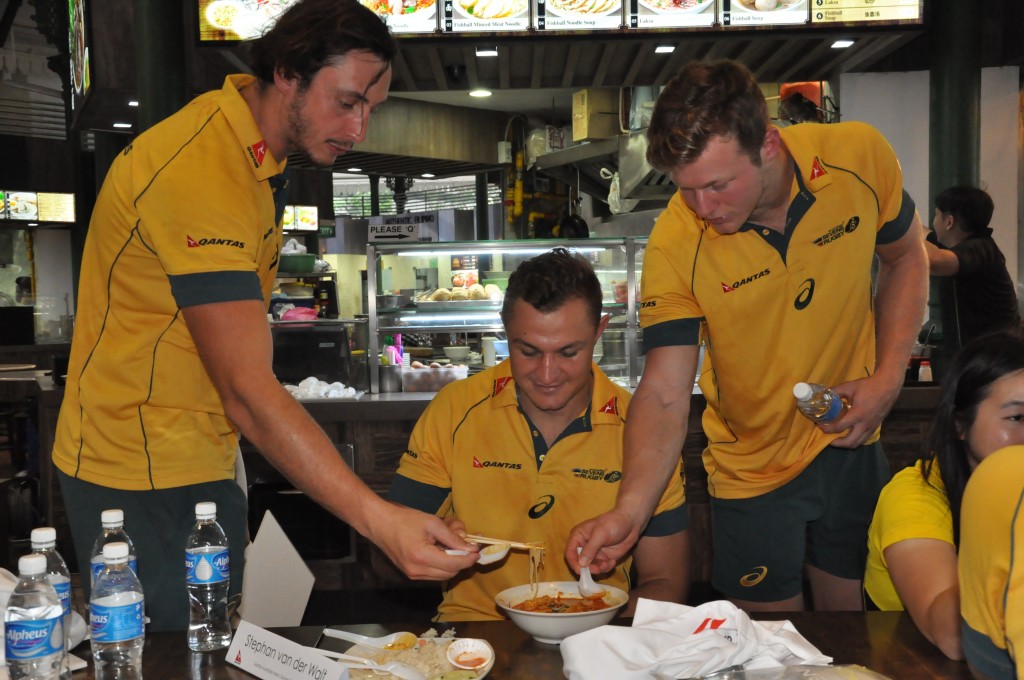 The rugby players help themselves to some Laksa made by Chef Ah Huat.