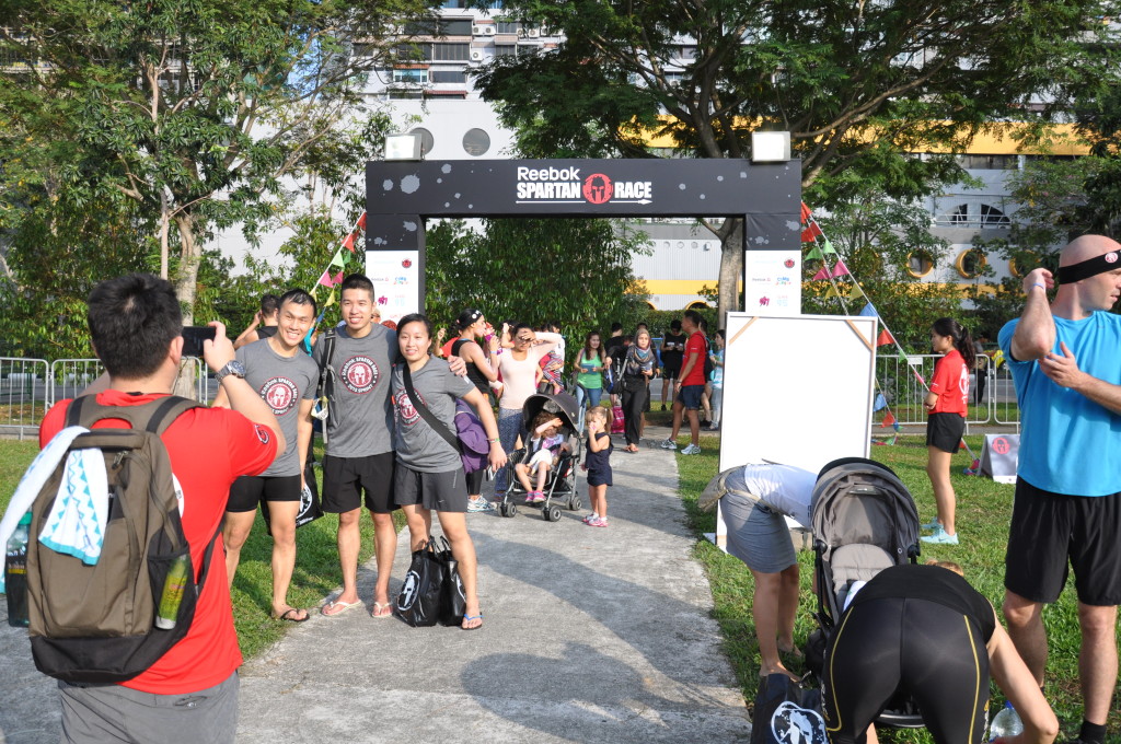 Participants take a photo before entering the Spartan race village.