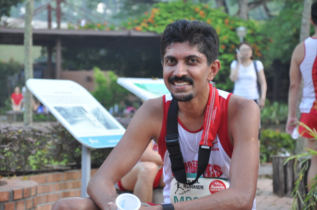 A runner relaxes after completing his run.