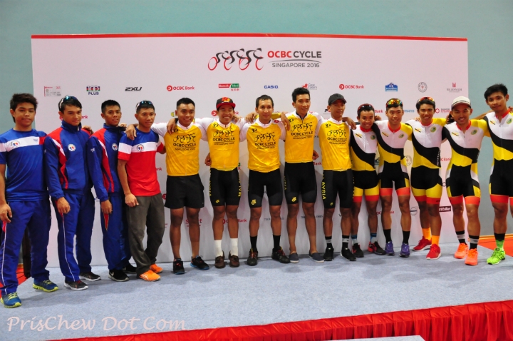 Team Philippines (left in blue), Team Malaysia (centre in yellow), and Team Brunei (right in yellow), posing for a group photo after the victory ceremony of the OCBC Cycle Southeast Asia Speedway Championship at Singapore Sports Hub.