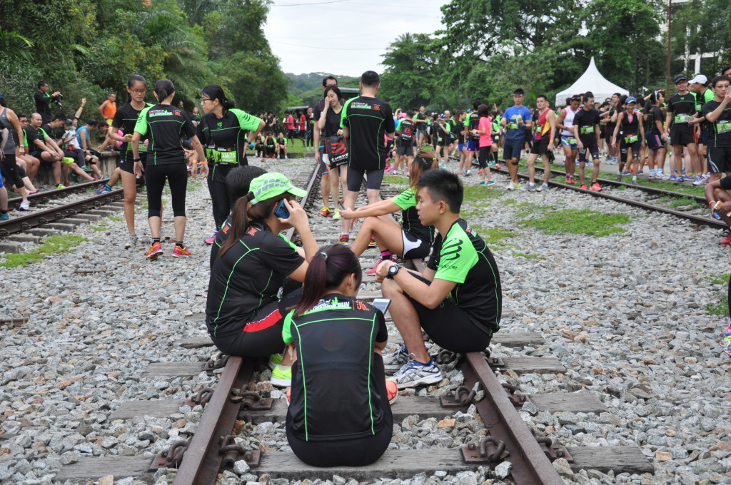 Runners chill out at the starting line at Bukit Timah.