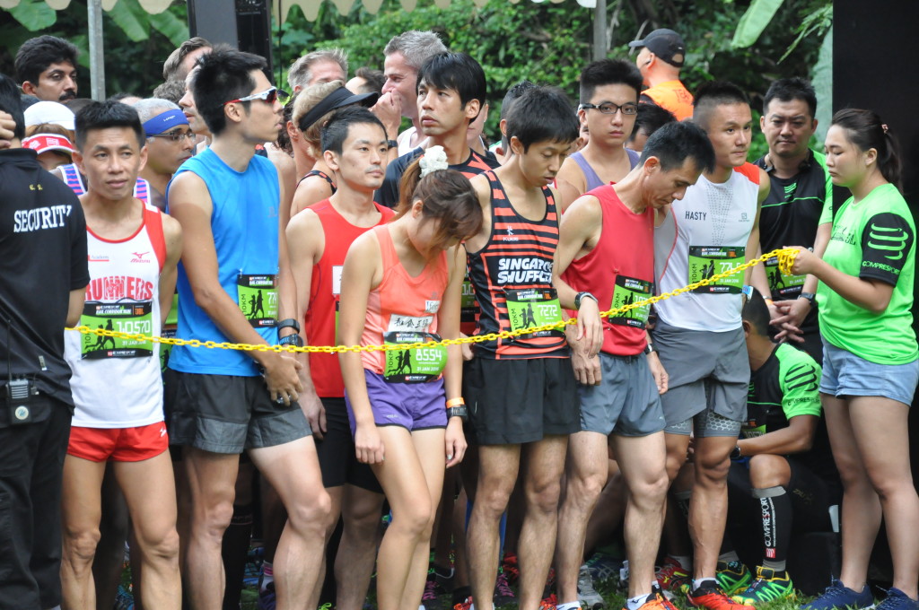 Runners in the start pen wait for the race to start.