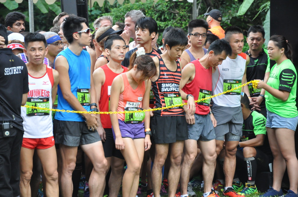 Runners in the start pen wait for the race to start.