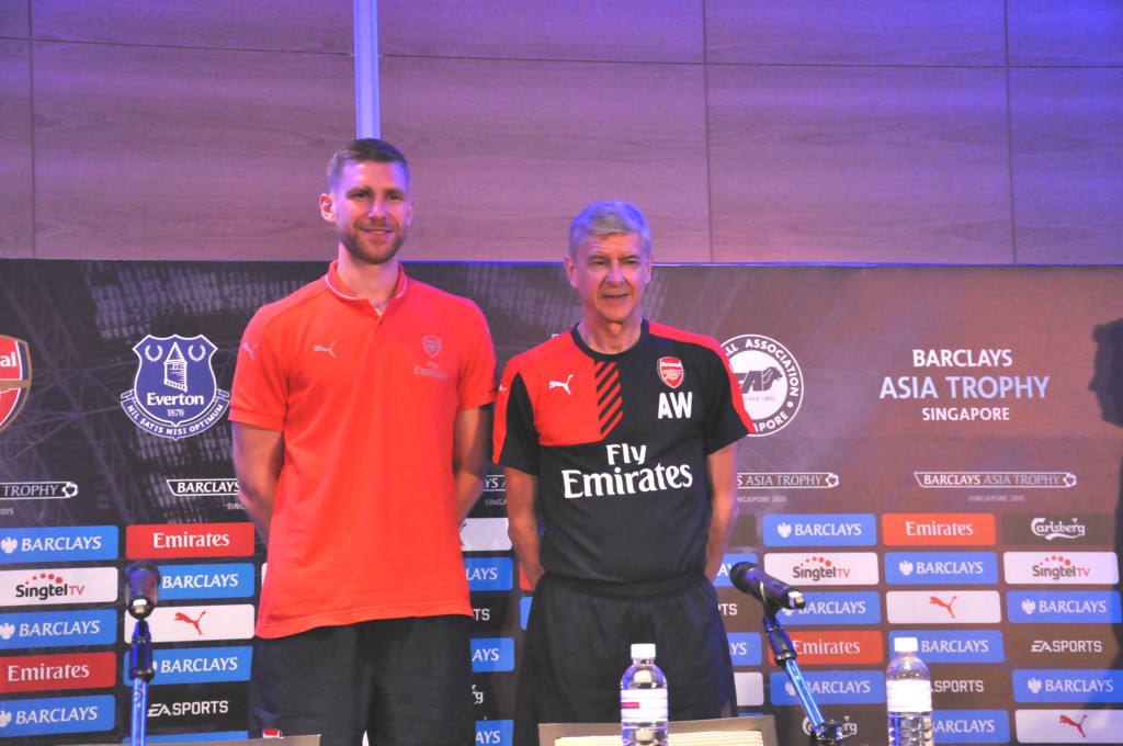 Arsenal defender Per Mertesacker and manager Arsene Wenger.
