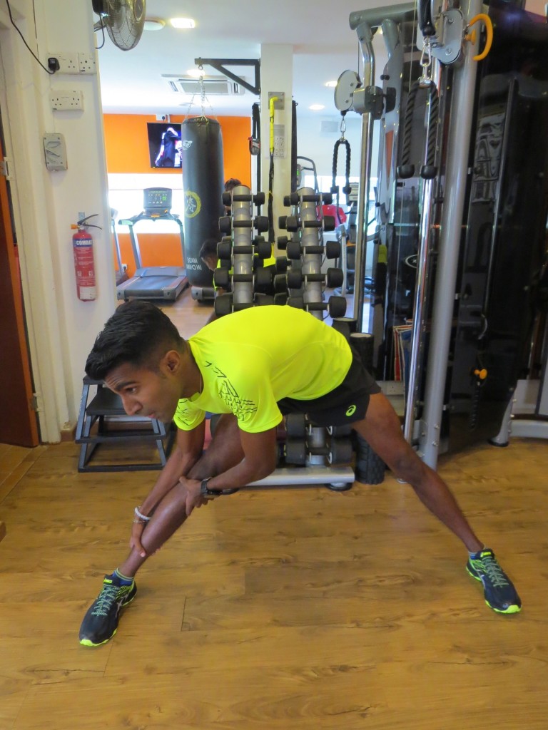 Raviin is happy to help his amateur team mates during training and the race. [Photo courtesy of ASICS].