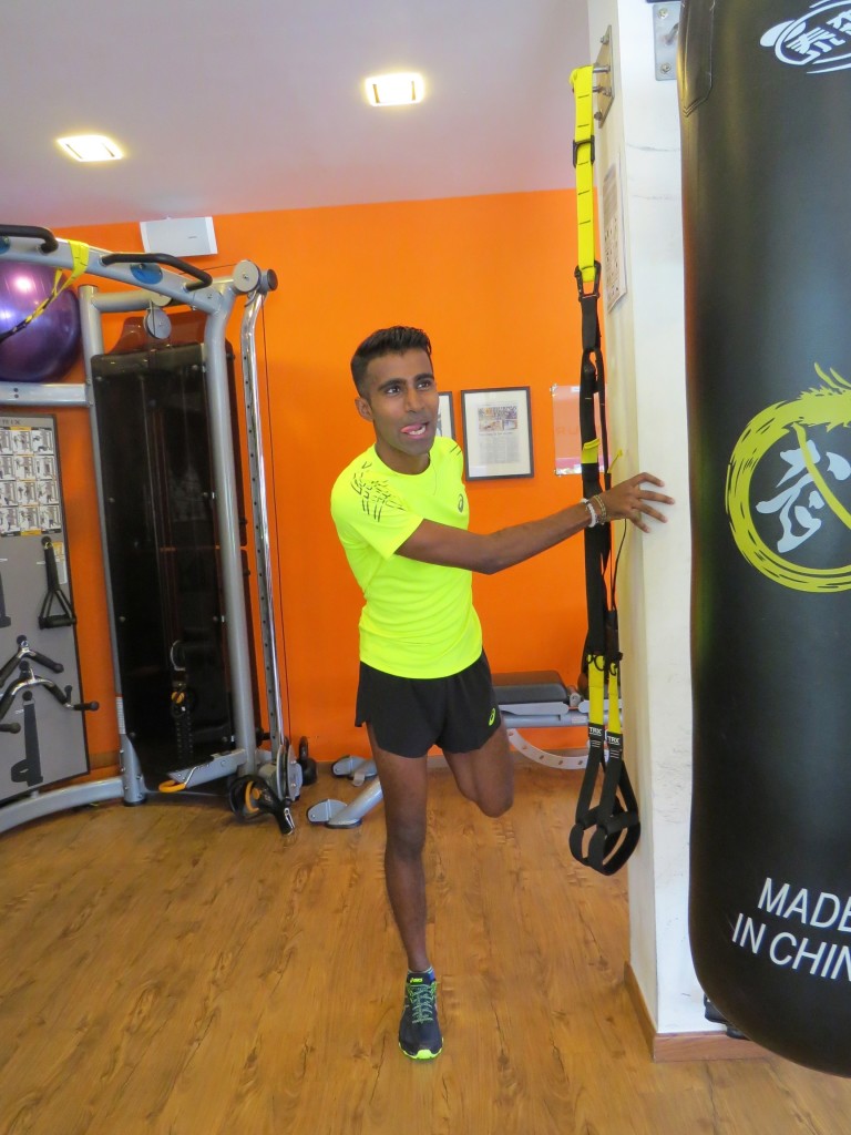 Raviin does some stretching exercises after a training session at Altitude Gym. [Photo courtesy of ASICS].
