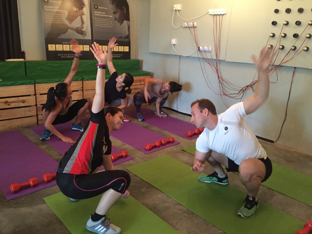 One of WorldTrainer's personal trainers demonstrates to me, one of the bodyweight exercises.