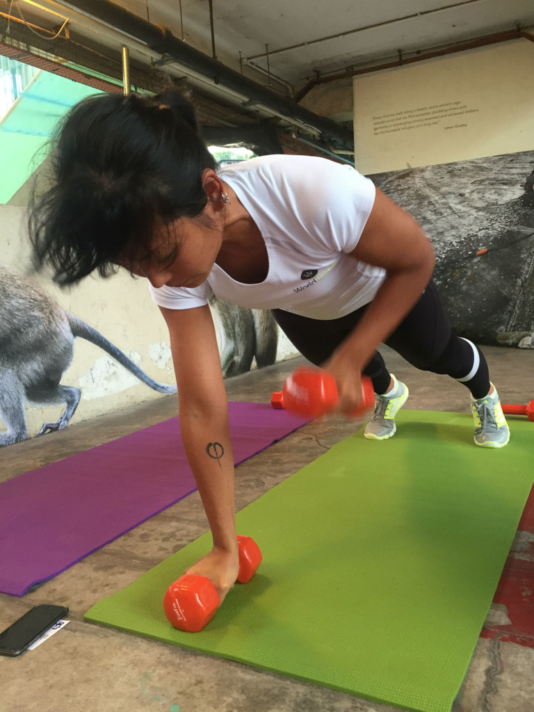 Lee demonstrates one of the exercises that she does.