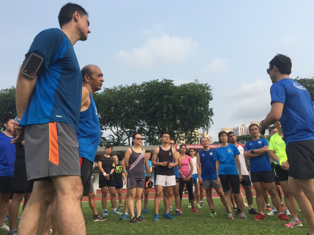 Participants listen while Ben (extreme right) briefs them after the drills.