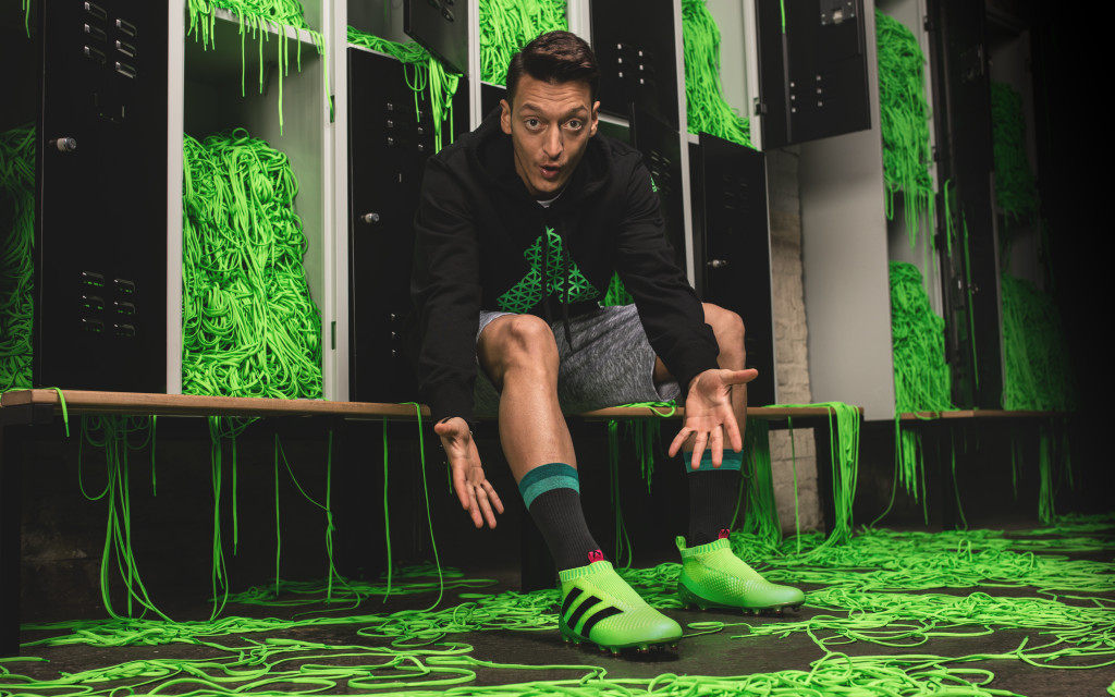 Arsenal's Mesut Oezil shows off the boots.