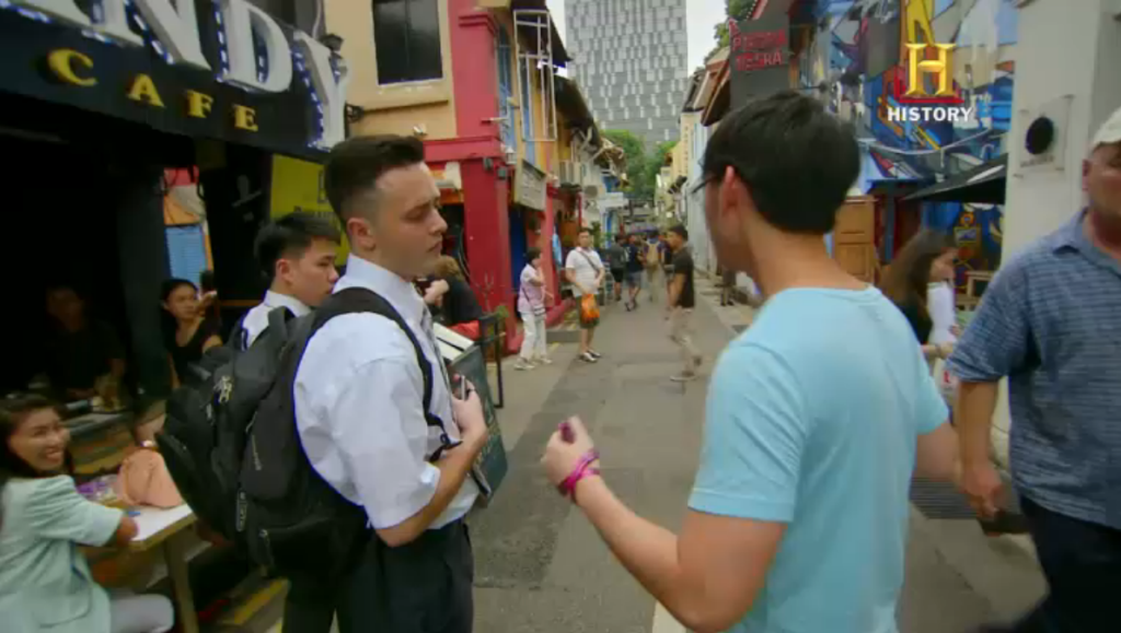 The photographers had to convince random passers-by to don attire and pose for photos in the second challenge. (HISTORY Channel Screen Grab)