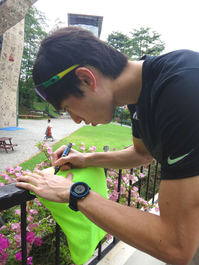 The champ signing an autograph.