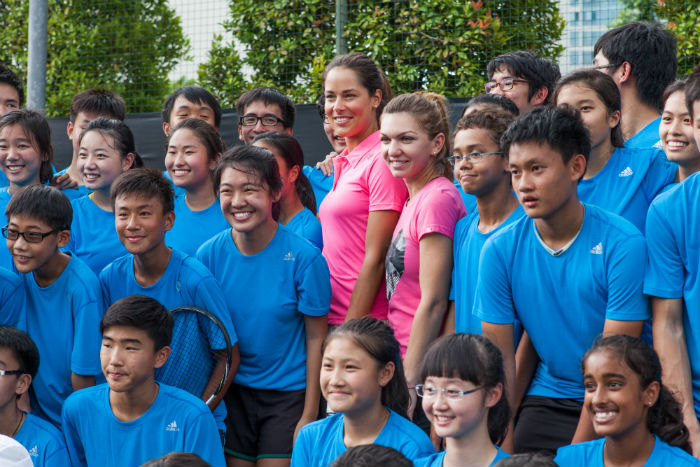 Ivanovic and Halep pose with the Raffles students. (Credit: Adidas Singapore)