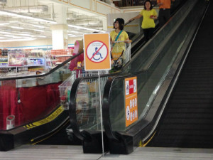 Frantically coming down the escalator.
