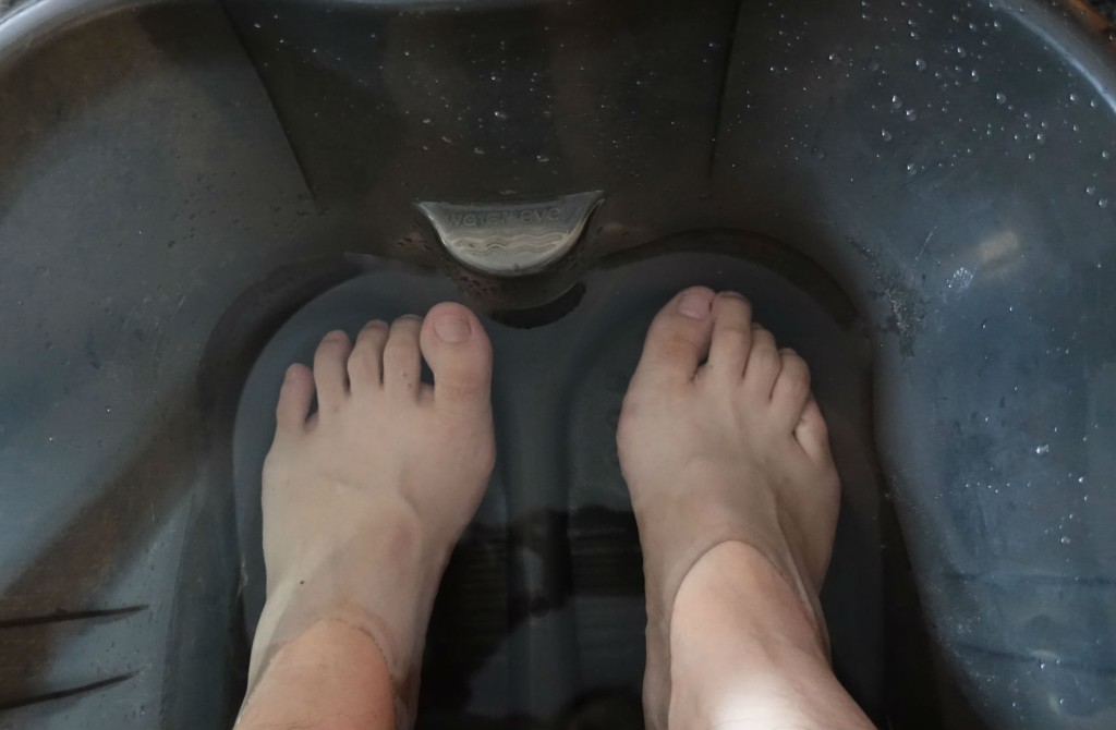 My feet getting soaked in warm water.