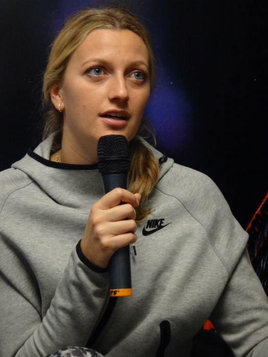 Kvitova tends to students' queries.