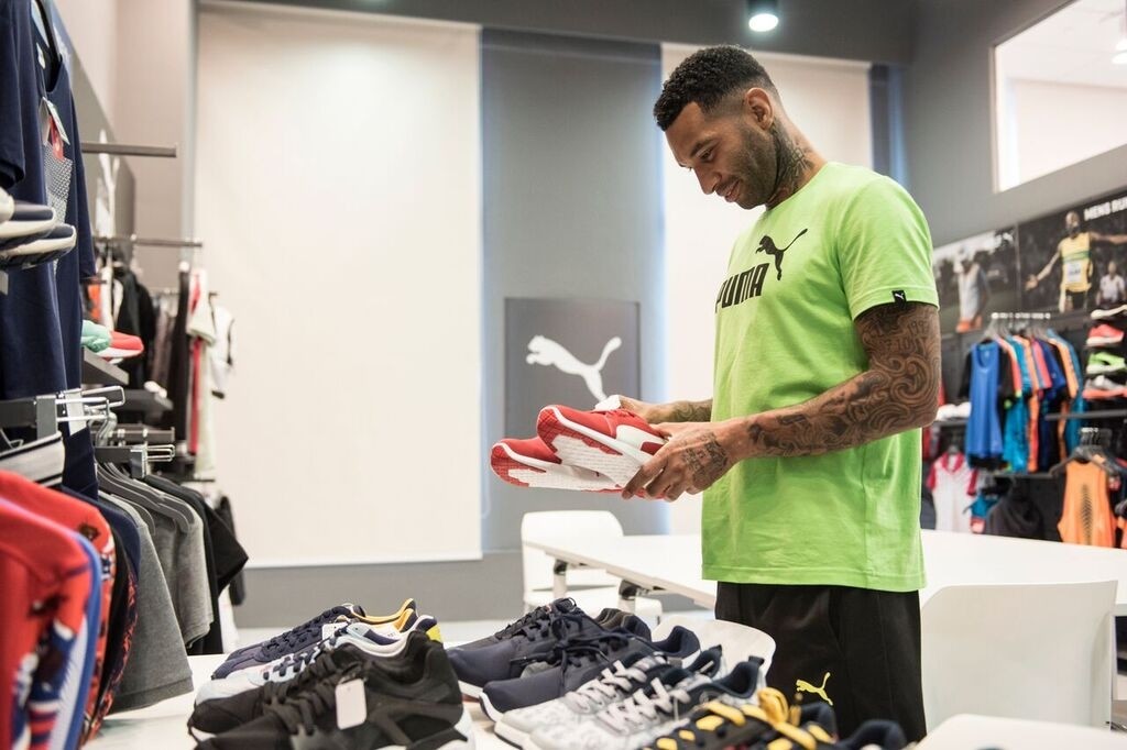 Pennant checks out PUMA football boots. [Photo from PUMA]
